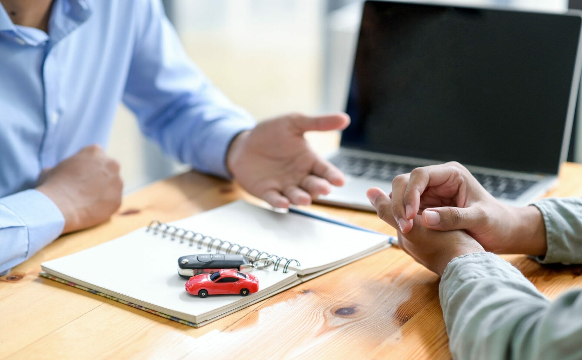Finance staff are recommending car loans for customers.